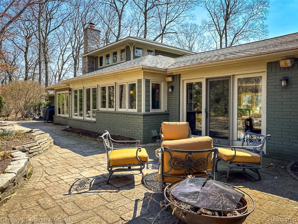 View of patio with a fire pit