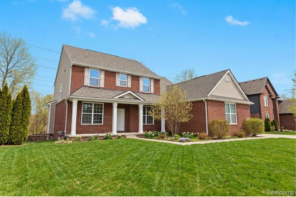 Living area featuring a fireplace and wood finished floors