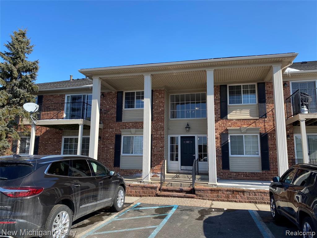 6157 ORCHARD LAKE RD APT 201, West Bloomfield, MI — front exterior