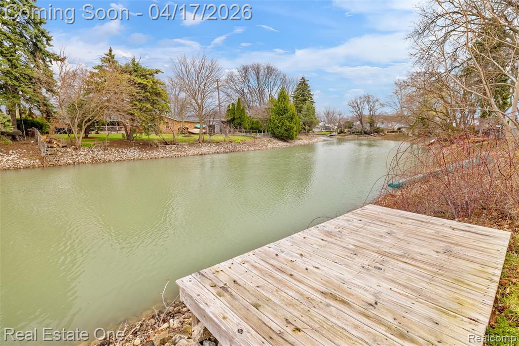 Dock area featuring a water view