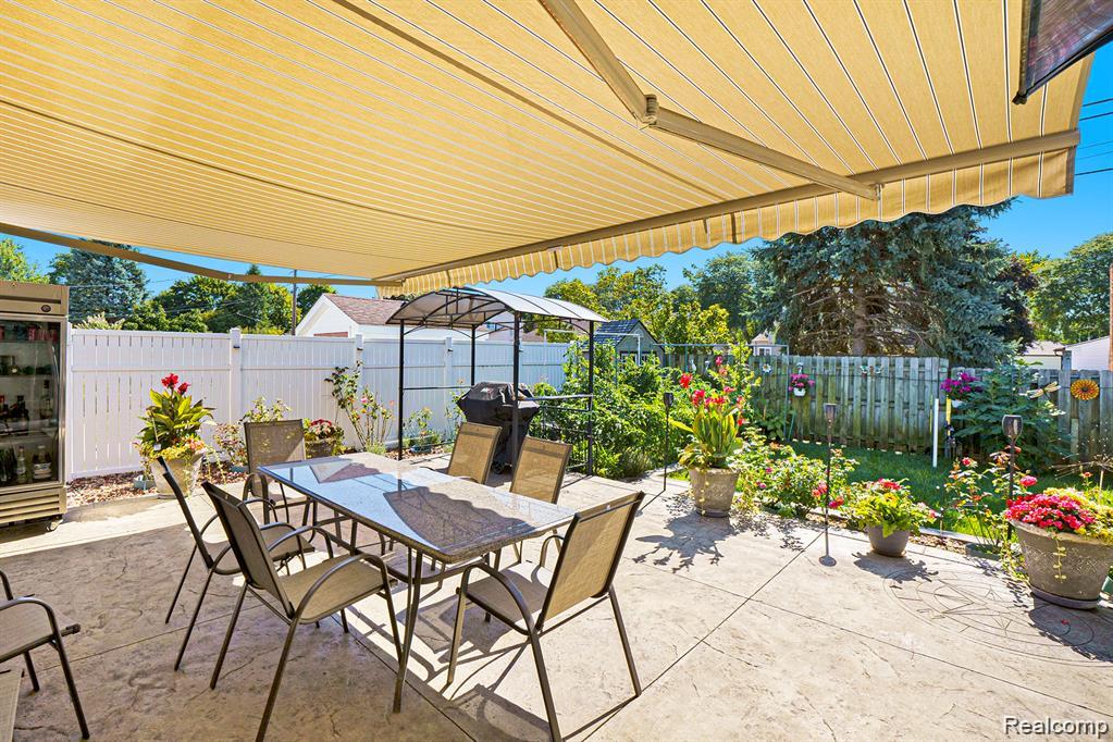 View of pool with a storage unit, a fenced backyard, a wooden deck, and patio surround