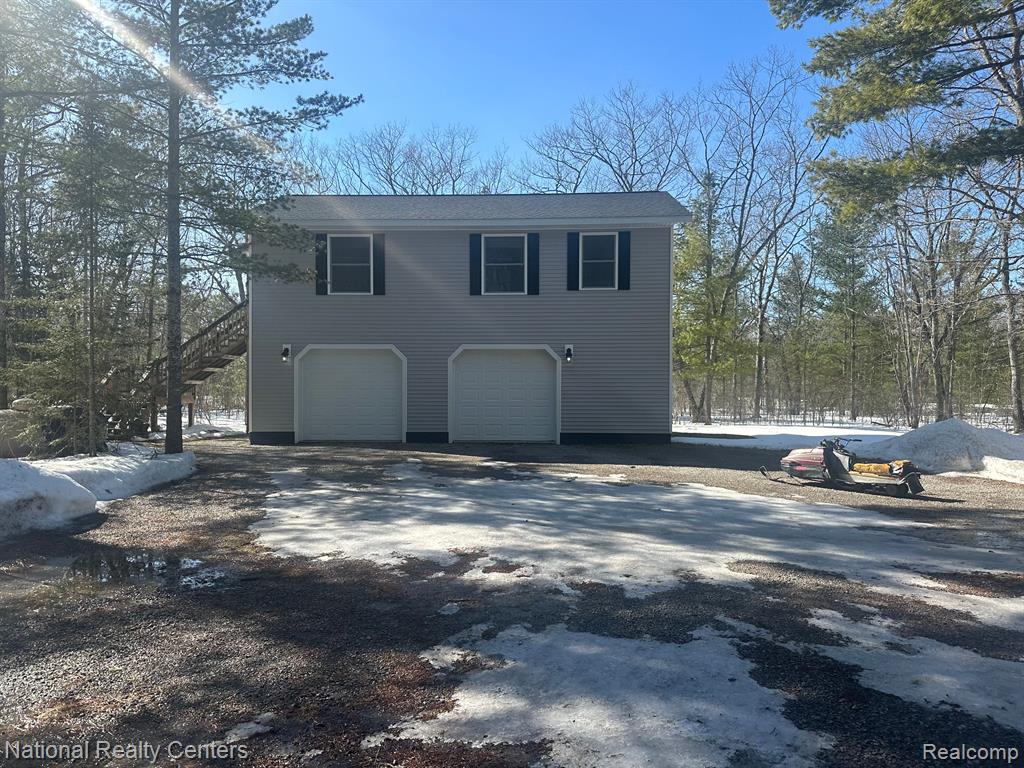 15967 NE SPRUCE Drive E, Presque Isle, MI 49777 — front exterior